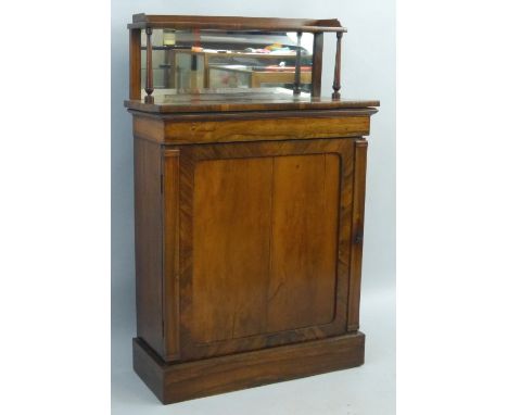 A 19th Century rosewood chiffonier, the raised mirrored back with three quarter gallery on a narrow shelf supported by turned