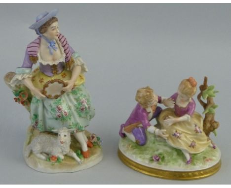 A Sitzendorf figure, of a lady in 18th Century costume seated on a tree trunk holding a tambourine with a lamb at her feet, 1