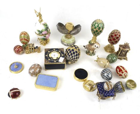 An assortment of enamel items. Including clocks, boxes, eggs, charms, etc.