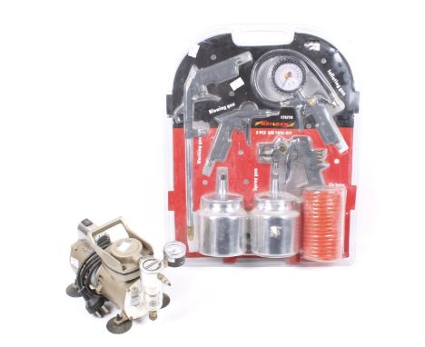 A vintage Sparmax air compressor and a set of air tools. The compressor 240v, the tools in the original packaging