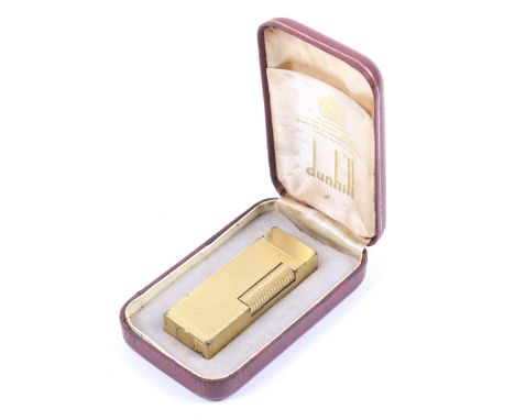 A vintage boxed Dunhill gold plated cigarette lighter. With textured decoration, L6.5cm