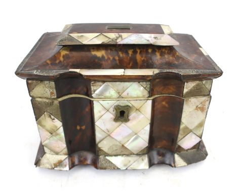 A 20th century tea caddy. Inlaid with tortoiseshell and mother of pearl, opening to reveal two lidded compartments, L16cm