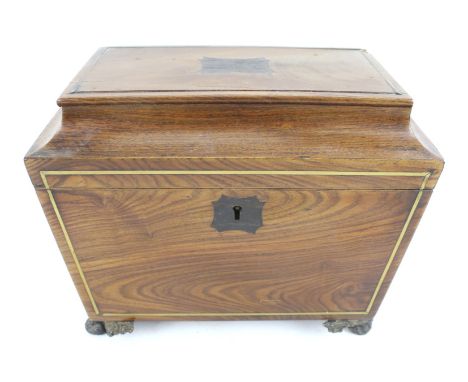 A Victorian sarcophagus tea caddy. Opening to reveal two lidded compartments, raised on gilt claw feet, H16cm