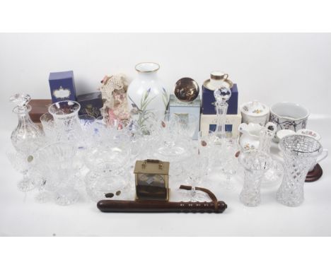 An assortment of glass, ceramics and collectables. Including two decanters, a vase decorated with birds, wooden truncheon ,et