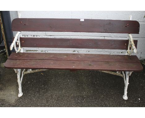 A 20th century bench. The wooden planks painted red, the cast metal ends painted white, H82cm x W143cm x D50cm