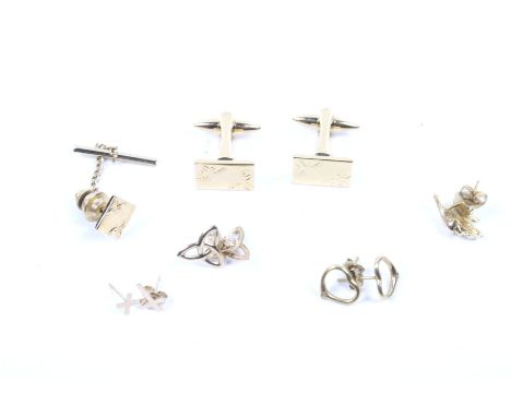 An assortment of jewellery. Including a collection of stud earrings, one pair in the form of a dolphin. The butterflies only 