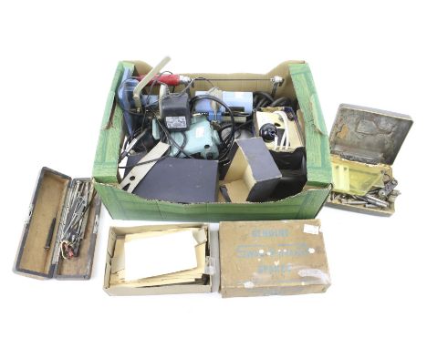An assortment of watch related tools, recommended for restoration purposes. Including drills, measuring tools, cogs, etc.