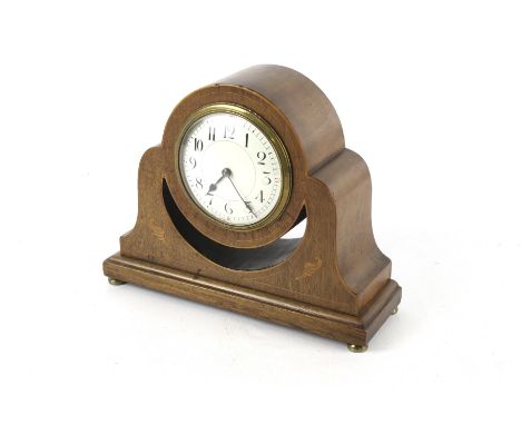 A sheraton revival mahogany mantle timepiece. The white enamel dial with Arabic numerals, the case has inlaid stringing and d