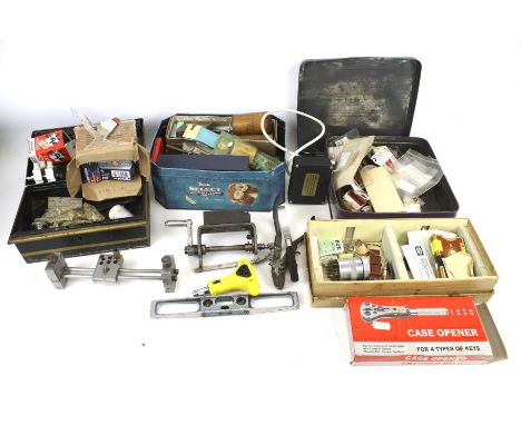 An assortment of watch related tools and accessories, recommended for restoration work. Including magnifying glasses, pliers,