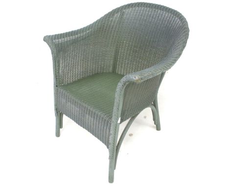 A vintage green painted Lloyd Loom tub chair. With original paper label. H72cm