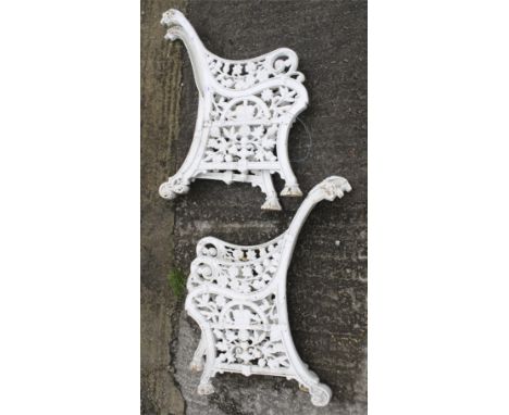 Two pairs of cast metal bench ends. Decorated with British symbols surrounding the emblem of a crown, painted white, H85cm Co