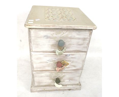A vintage chest drawers. Three drawers, raised on a plinth base, painted grey with applied decoration to the top, H62cm x W42