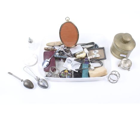 An assortment of 19th century and later collectables. Including a brass tea caddy, napkin rings, picture frames, etc.