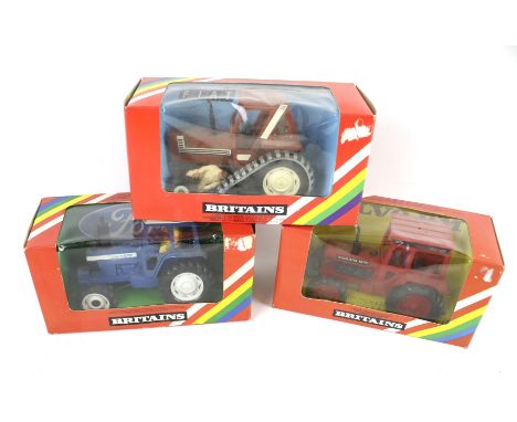 Three Britains 1:32 scale tractors. Comprising a Ford Tractor 9523, a Volvo Tractor 9521 and a Fiat Half-Track Tractor 9527, 