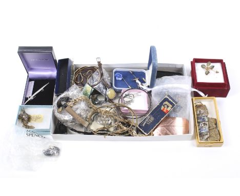 An assortment of costume jewellery. To include tie pins, necklaces etc