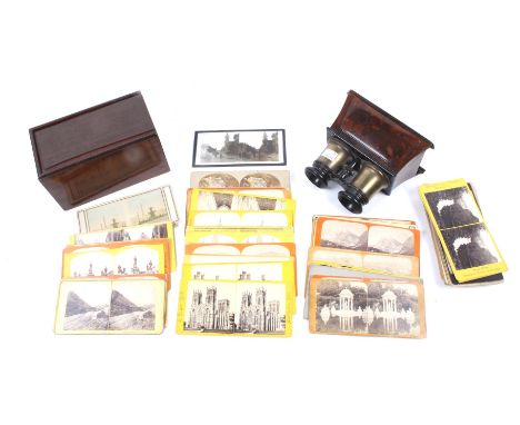 A collection of Victorian camera equipment and slides. Comprising early stereoview photographs in a period wooden storage box