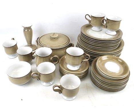 A vintage Denby Pottery tea and dinner service. In graduated brown glaze, including cups and saucers, plates, tureens, etc.
