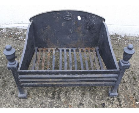 A vintage cast metal fire grate. Painted black, L60cm