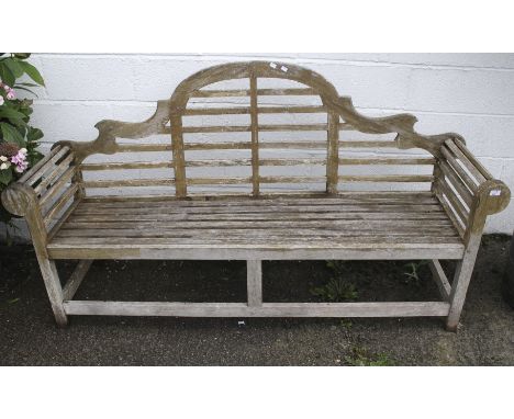 An lutyens style wooden garden bench. H105cm x W195cm x D51cm
