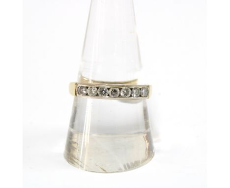 18ct gold diamond eternity ring, chanel set with a row of seven brilliant diamonds, London 1993 