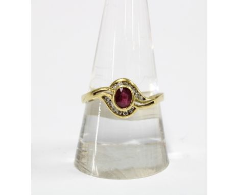 18ct gold ruby and diamond crossover dress ring 