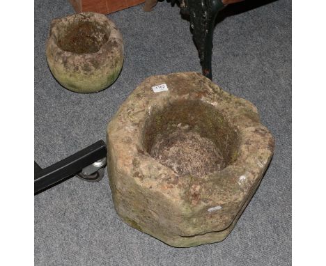 A weathered stone planter, 40cm diameter by 28cm high approx; and a smaller example (2)  