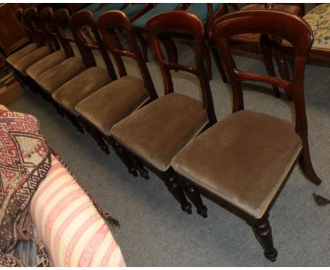 A set of eight Victorian mahogany balloon-back dining chairs, labelled Bartholomew and Fletchers upholsterers, 217 &amp; 219 