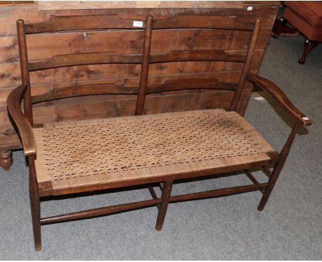 A rush-seated ladder-back bench, 120cm wide  