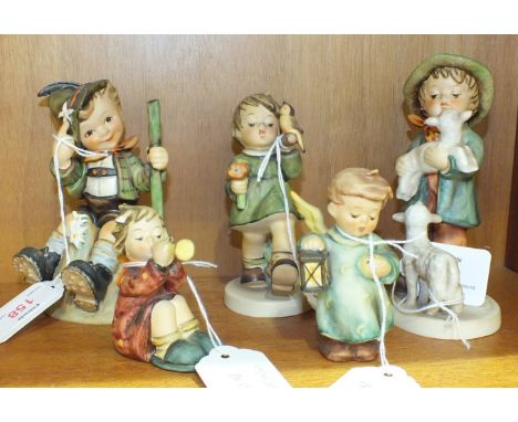 Five Goebel Hummel figures: 'Shepherd's Boy', 'Mountaineer', 'Gay Adventure', 'Boy seated with horn', 'Angel holding lantern'