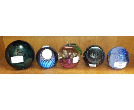 Four Caithness glass paperweights, 'Chevrons', 'Windfall', 'Into the Light 2004', '40 Celebration' and another fitted with a 
