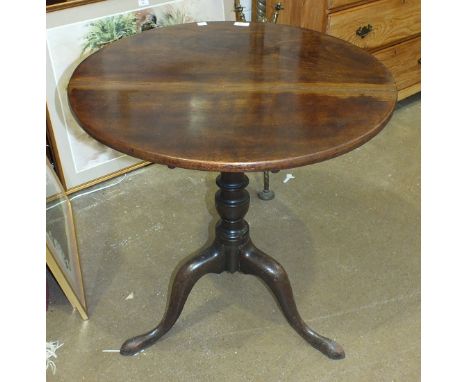 A Georgian mahogany tilt-top table on tripod base, 68cm diameter and three framed prints, (4).