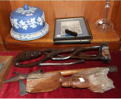 A blue and white jasperware cheese dish and cover, (a marriage), a carved wood native figure, a glass decanter and miscellane