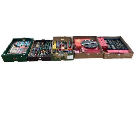 Five boxes of model railway engines, rolling stock and track including Hornby, Triang, Lima, Airfix, etc.