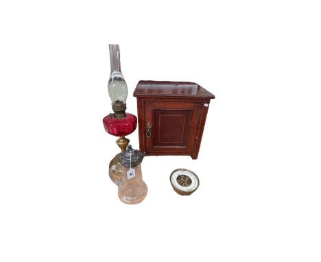 Warings & Gillow small Edwardian mahogany cabinet, Cranberry oil lamp, barometer and an EPNS claret jug.