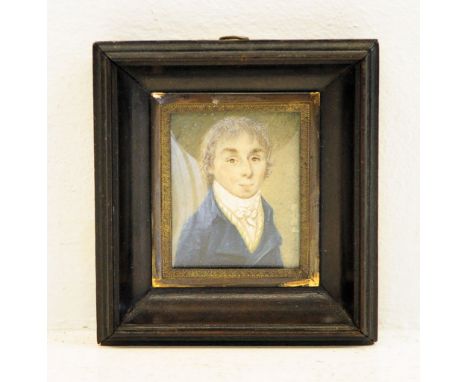 A miniature Portrait of a Gentleman, late 18th/early 19th century, half length, in a blue coat, in a wooden frame, inscriptio
