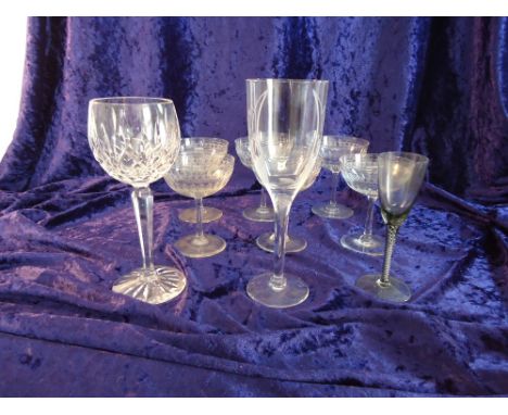 A Lalique winged Angel pattern Champagne Flute, a set of six etched glass champagne saucers and two other glasses.