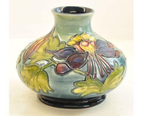 A Moorcroft Columbine pattern Vase on a light blue ground.  4 ¼" (10.5cms) high.