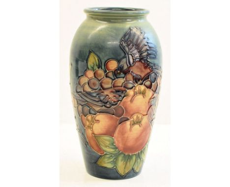 A Moorcroft Finches pattern Vase on a light blue ground (marked with a silver line to base).  7 ¼  (18.5cm) high.