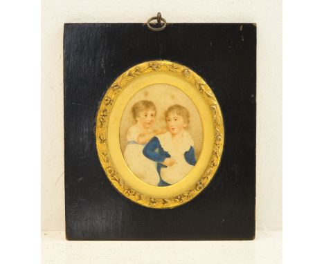 A miniature oval Portrait of two Boys, the ebonised frame with a gilt slip and inscribed on the reverse "George Robert Dawson