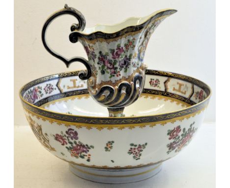 A Samson Armorial Ewer and Basin decorated in Oriental Famille Rose flowers, the ewer on a pedestal foot.  11 1/2" (29cms) di