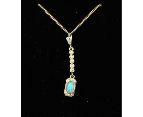 A sterling silver Pendant of Art Deco design set with an oval opal.