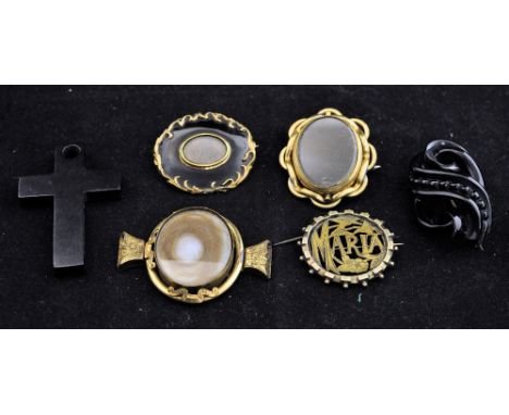 An early Victorian black enamel Memento Mori Brooch, two others, jet Brooch and other items.