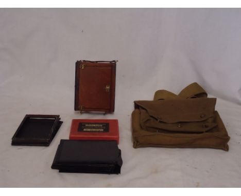 A quarter plate Camera with glass plates in a military canvas bag inscribed 'H G & R Ltd.'