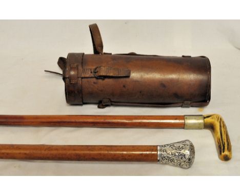 A silver mounted Malacca Cane, a horn handled Cane and a leather Flask.