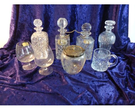 A square glass Spirit Decanter with silver label, three other decanters and various other items of table glass.