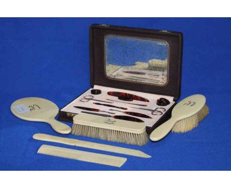 EARLY 20TH CENTURY IVORINE DRESSING TABLE SET
including a hand mirror, a hair brush, clothes brush, shoe horn and comb; toget