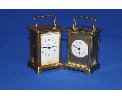 TWO MODERN BRASS CARRIAGE TIMEPIECES
together with a modern brass chronometer style desk clock, novely 'wagging eyes' wooden 