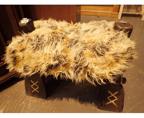 Large decorative carved saddle stool 