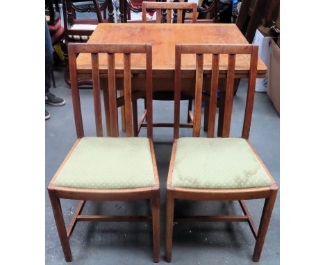Early 20th century light oak draw leaf dining table, with three Ercol dining chairs. Table Approx. 77 x 150 x 83cms
reasonabl