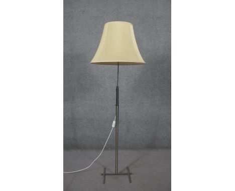 A chrome abstract design standard lamp with cream silk shade. H.162 Diam.56cm 
